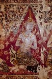 Wat Yai Suwannaram dates from the 17th century Ayutthaya period. The murals display celestial beings.