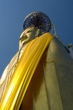 The main feature of Bangkok's Wat Intharawihan is the 32-metre high standing Buddha called either Luang Pho To or Phrasiariyametri. It took over 60 years to complete and is decorated in glass mosaics and 24-carat gold. The topknot of the Buddha image contains a relic of Lord Buddha brought from Sri Lanka. The temple was built at the beginning of the Ayutthaya period.