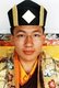 Trinley Thaye Dorje is the son of the 3rd Mipham Rinpoche of Junyung Monastery, one of several persons believed to be a reincarnation of Ju Mipham, an important lama of the Nyingmapa school, and Dechen Wangmo, the daughter of a noble family descended from King Gesar of Ling. At the age of six months the boy is reported to have started telling people that he was the Karmapa.<br/><br/>

In 1988 Shamar Rinpoche went on a secret visit to Lhasa to investigate whether Thaye Dorje was the reincarnation of the Karmapa, because, he said, the boy appeared to him in a dream. In March 1994, Thaye Dorje and his family escaped from Tibet to Nepal and then to India, where Shamar Rinpoche formally recognized him as the 17th Karmapa.