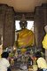 Thailand: Worshippers prostrate before a Buddha in one of the Khmer shrines at Wat Kamphaeng Laeng, Phetchaburi
