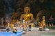 Thailand: Worshipper in front of a large seated Buddha inside Tham Khao Luang, Phetchaburi